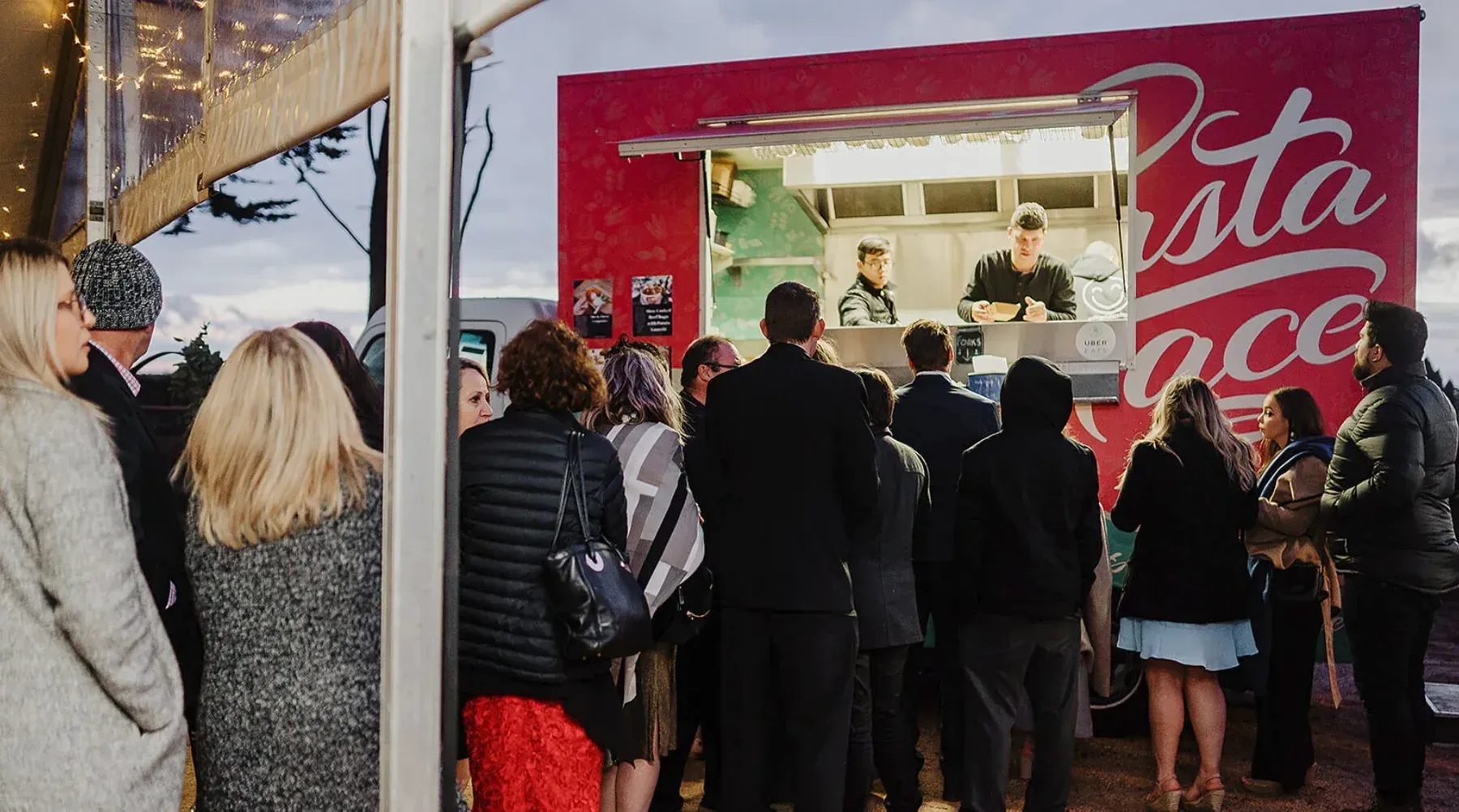 Wedding guests ordering from the Pasta Face food truck at Sarah and Aaron's Quirindi Stables reception in Newlyn North