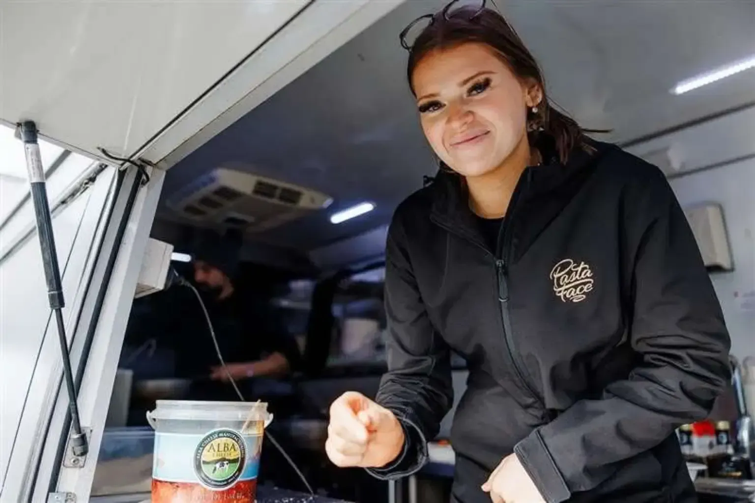 Pasta Face team member serving guests from the mobile kitchen at a Melbourne industrial site