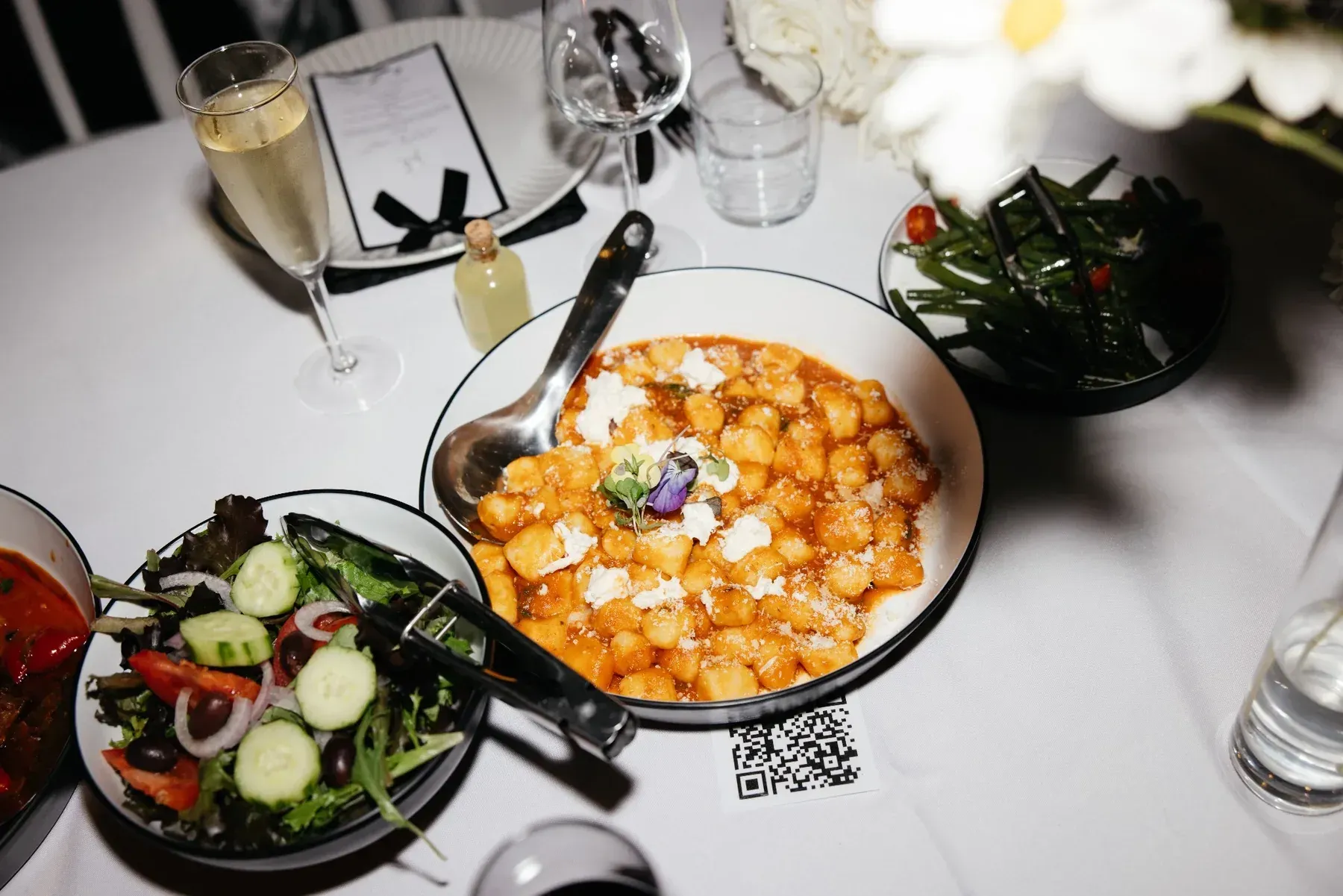 Shared gnocchi, salad and green beans served by Pasta Face at a sit-down wedding in Ballarat