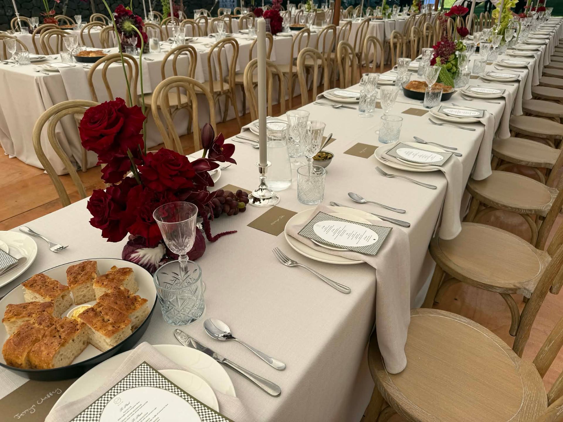 Elegant wedding reception tables prepared for a Pasta Face sharing sit-down celebration