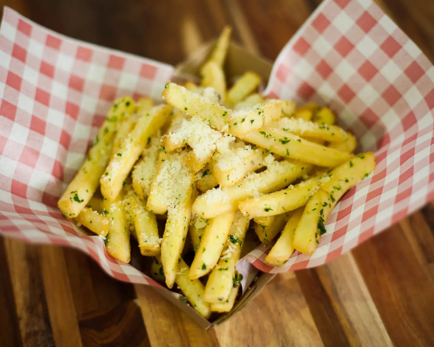 Truffle Parmesan Fries served in a takeaway tray