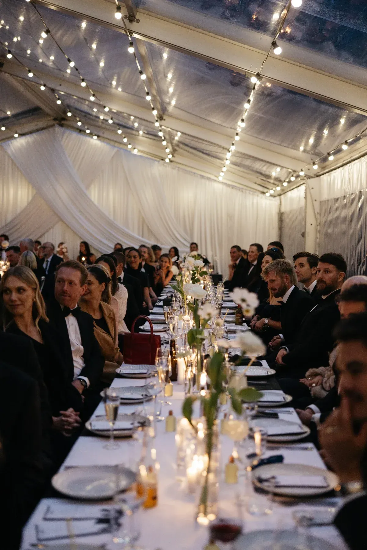 Guests seated for dinner during Tahlia and Jack's wedding reception at Willow & Stone Estate in Ballarat