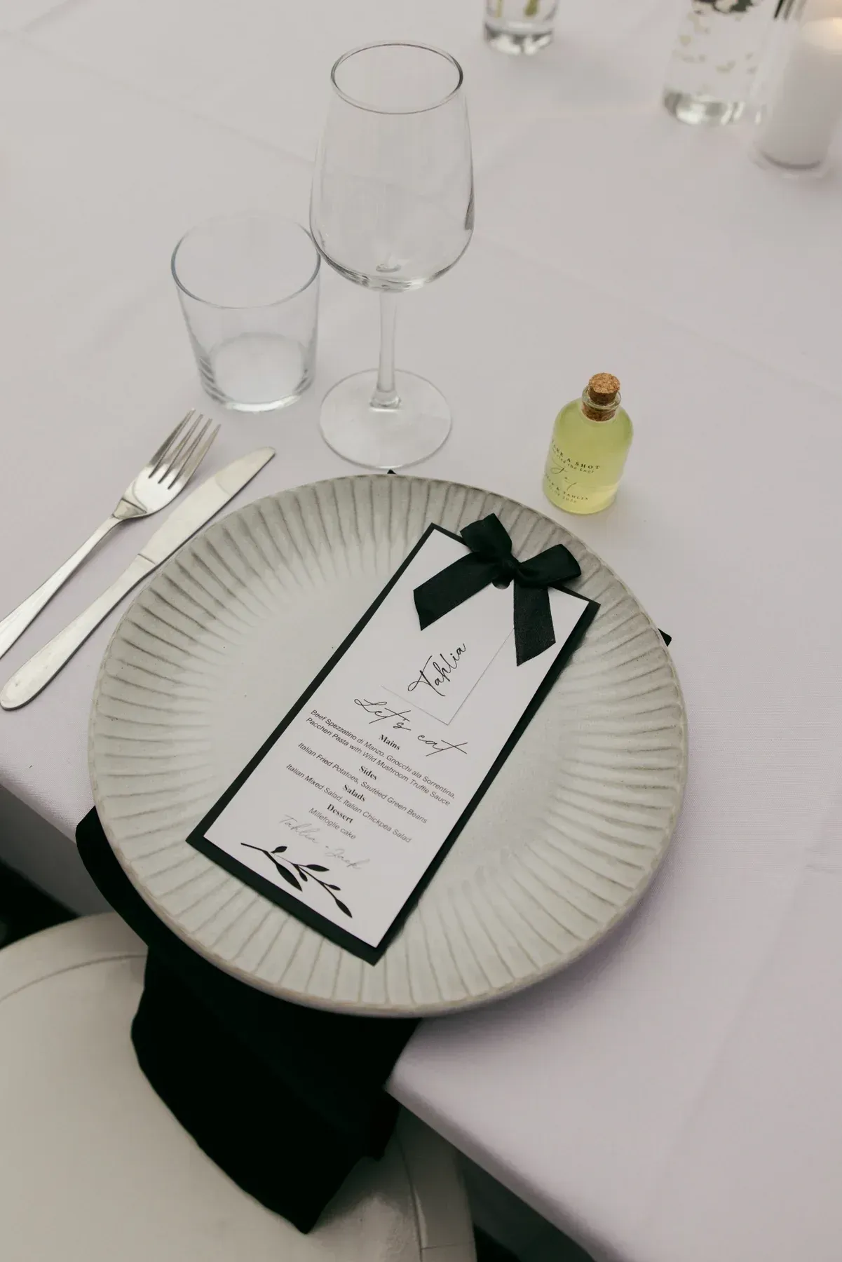 Wedding place setting prepared for Tahlia and Jack's shared sit-down reception at Willow & Stone Estate