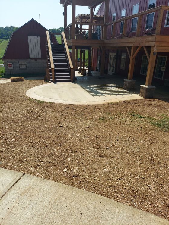 A large house with a wooden deck and stairs