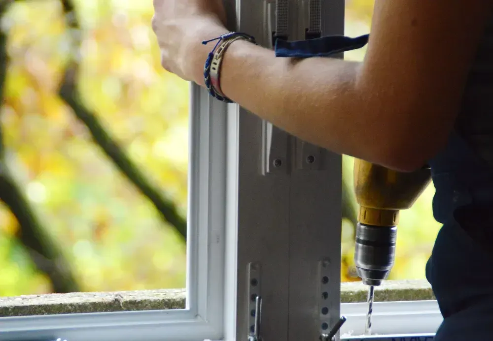 worker doing window and door installation