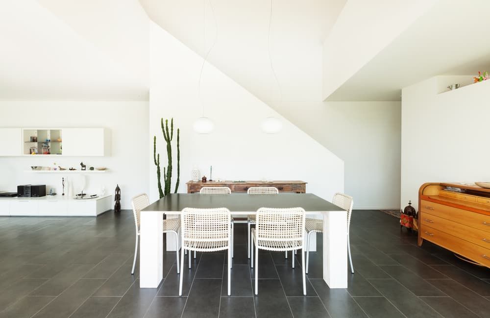 A Dining Room with A Table and Chairs in It — Cemak Constructions in Macksville, NSW