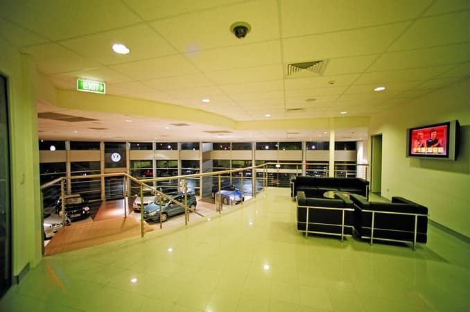 A Large Room with A Lot of Furniture and A Television on The Wall — Cemak Constructions in Port Macquarie, NSW