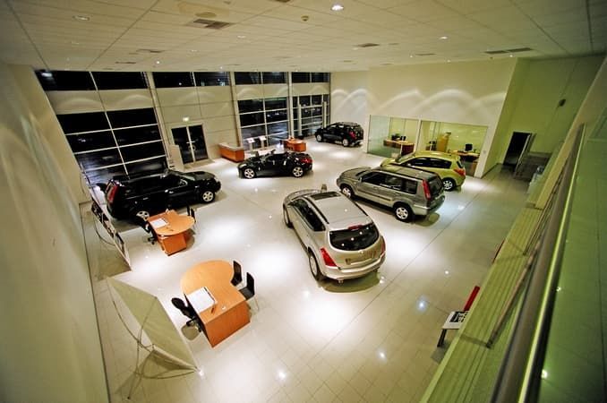 An Aerial View of A Car Showroom with Cars on Display — Cemak Constructions in Port Macquarie, NSW