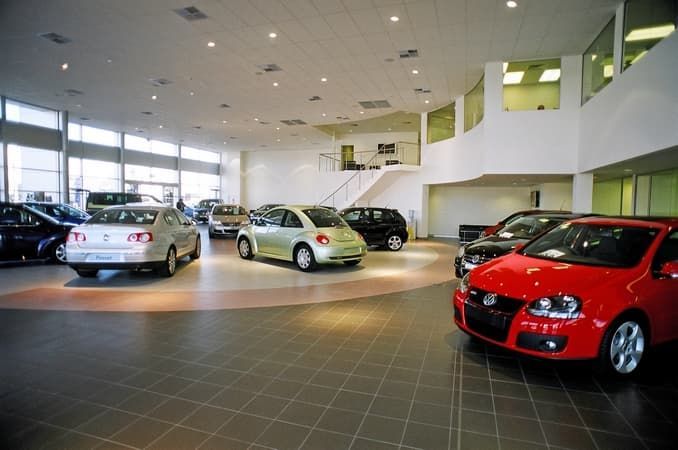 A Row of Cars Are Parked in A Car Dealership — Cemak Constructions in Port Macquarie, NSW
