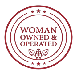 Maroon circular badge reading “Woman Owned & Operated” with small stars and leaf icon