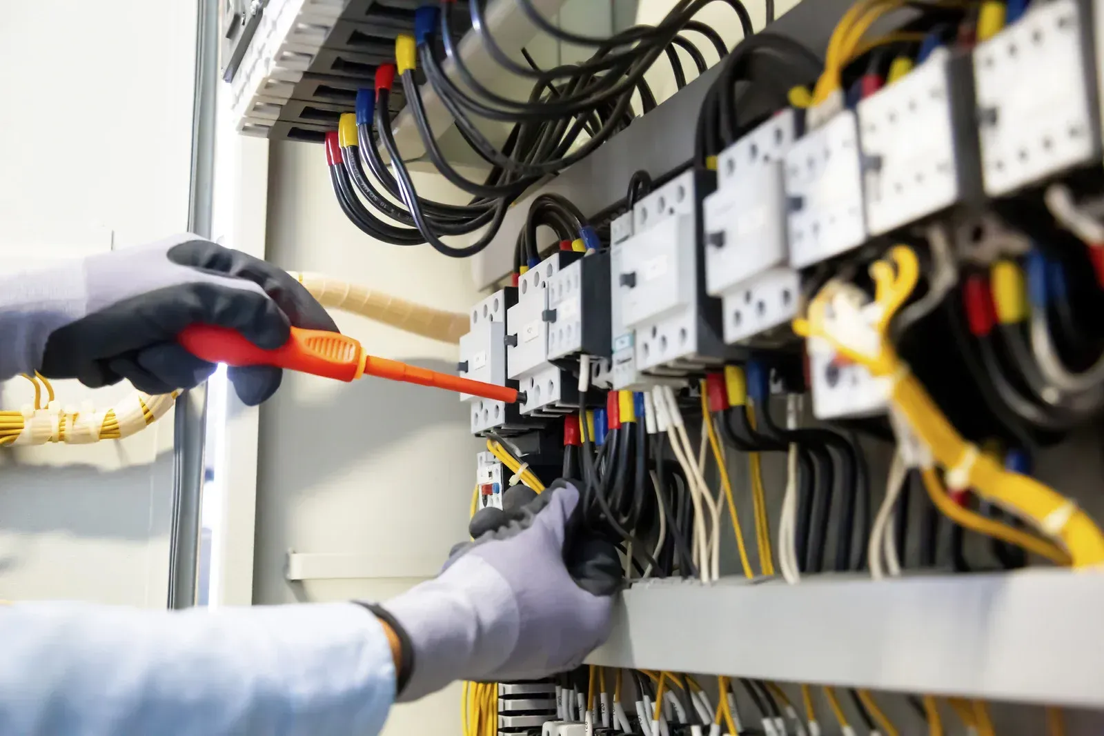 A bunch of wires are connected to each other in a box.