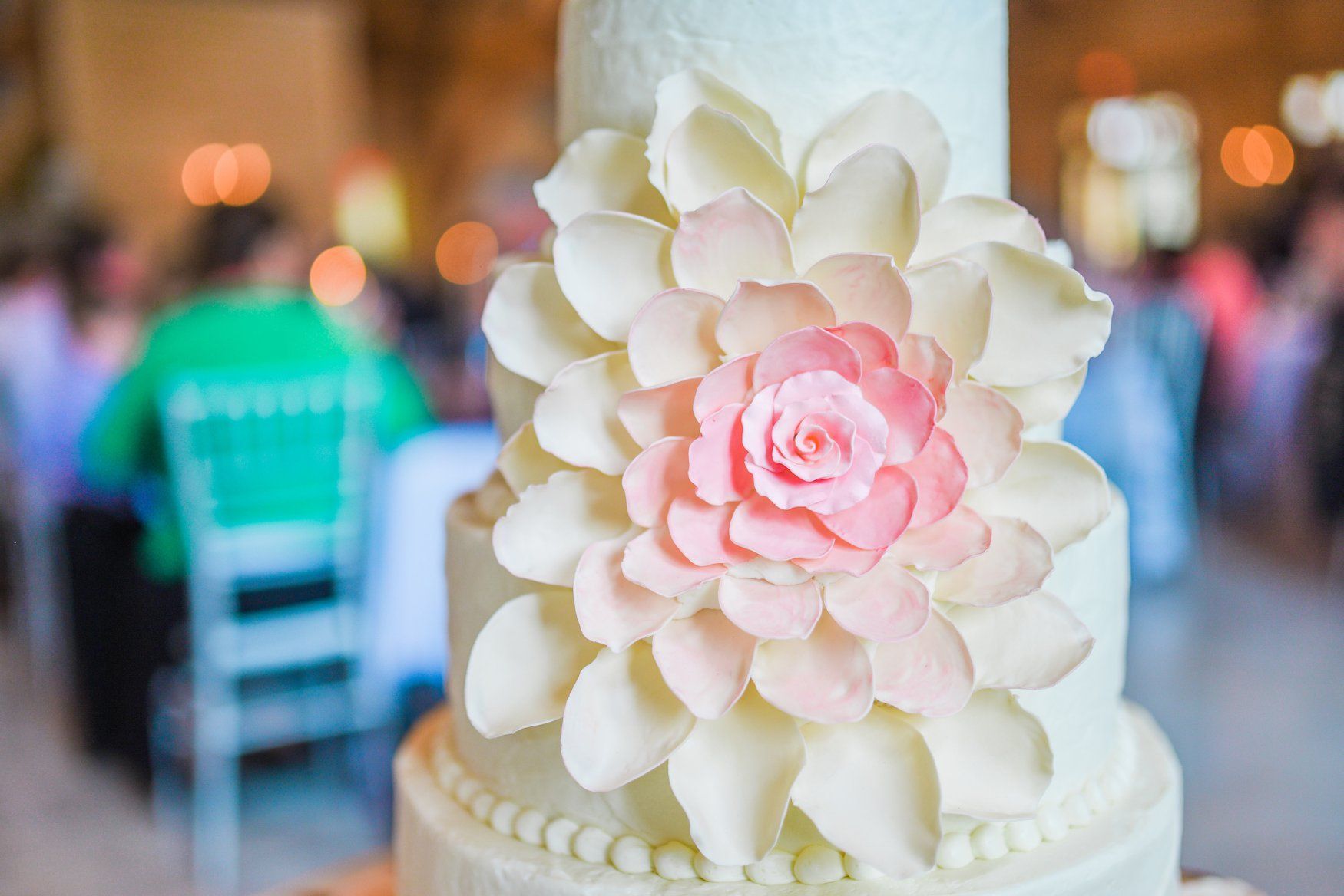 pink ombre flower on wedding cake