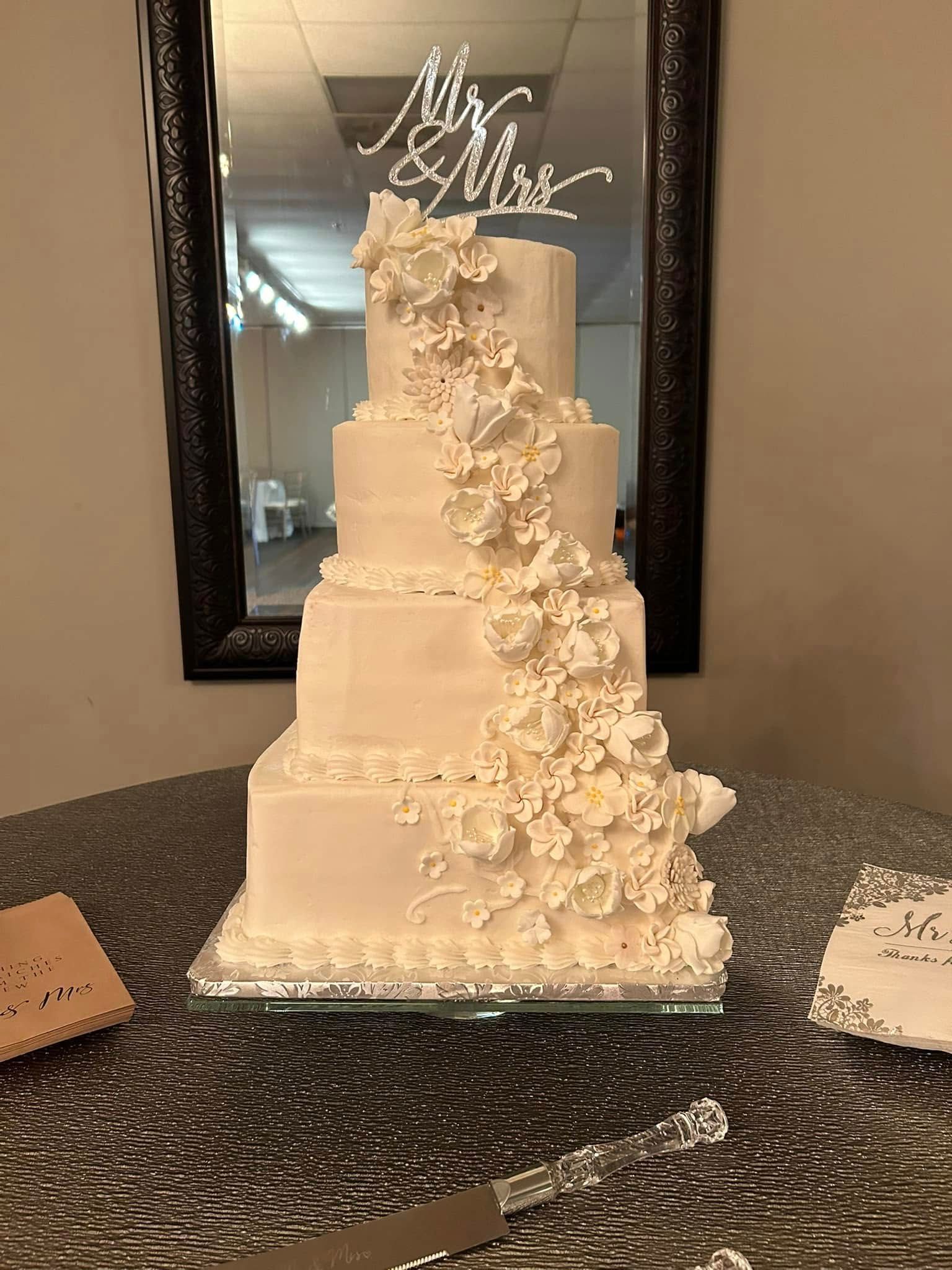 wedding cake with cascading floral design