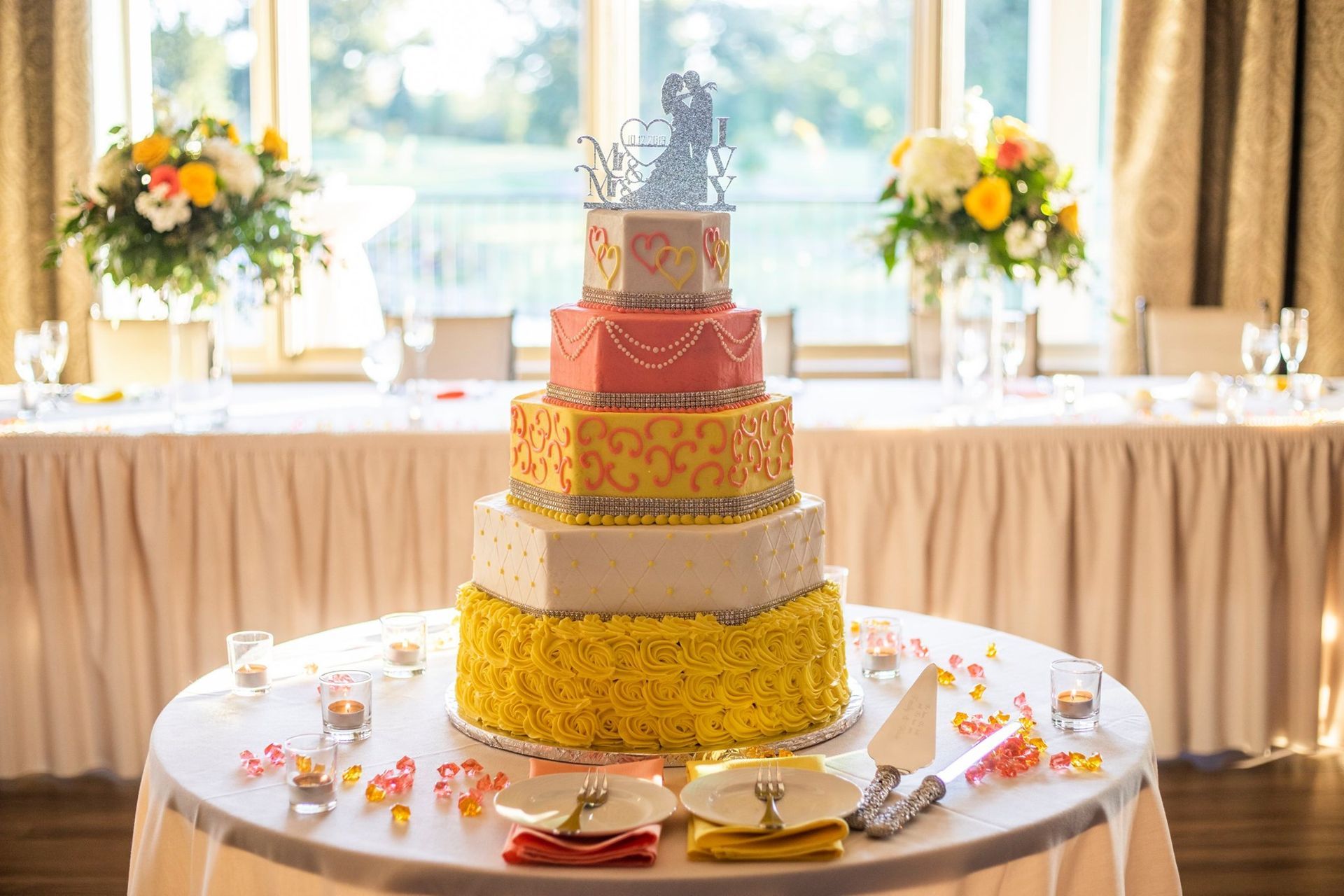 pink and yellow wedding cake