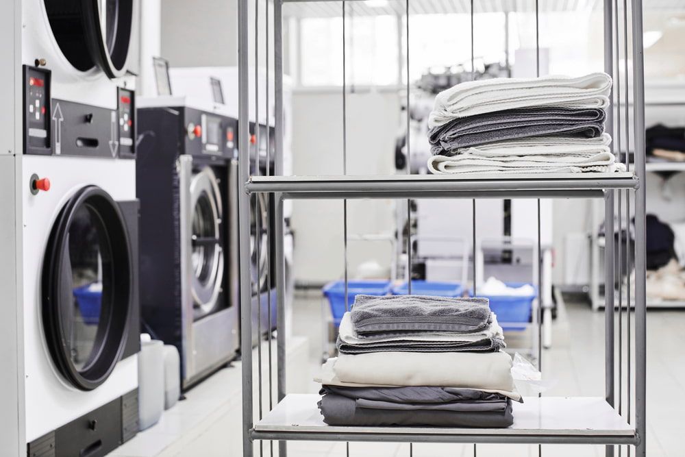 A Laundromat With a Stack of Clothes on a Shelf — Darwin’s Gas Man in Palmerston, NT