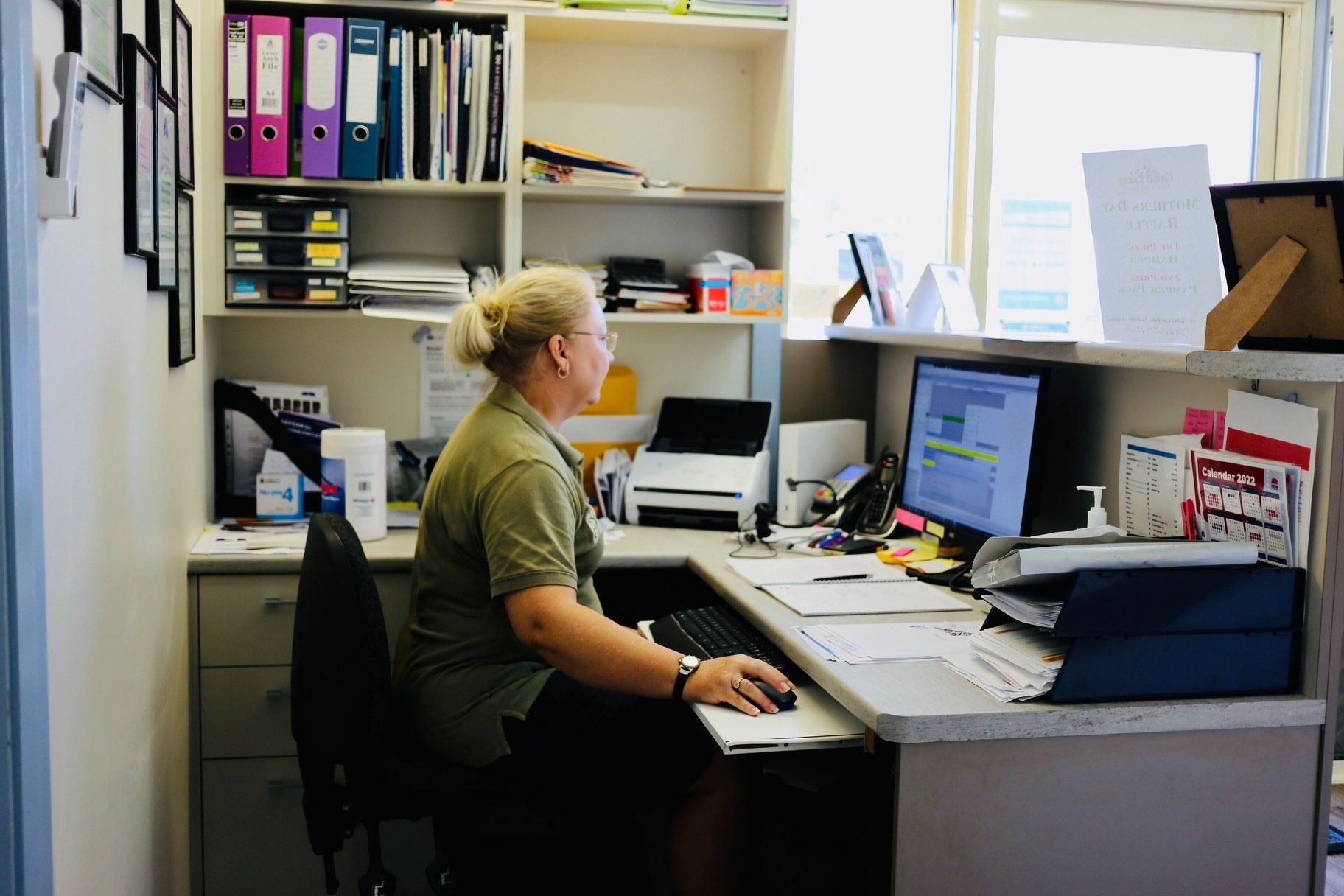 Receptionist at work — Podiatry In Forster, NSW