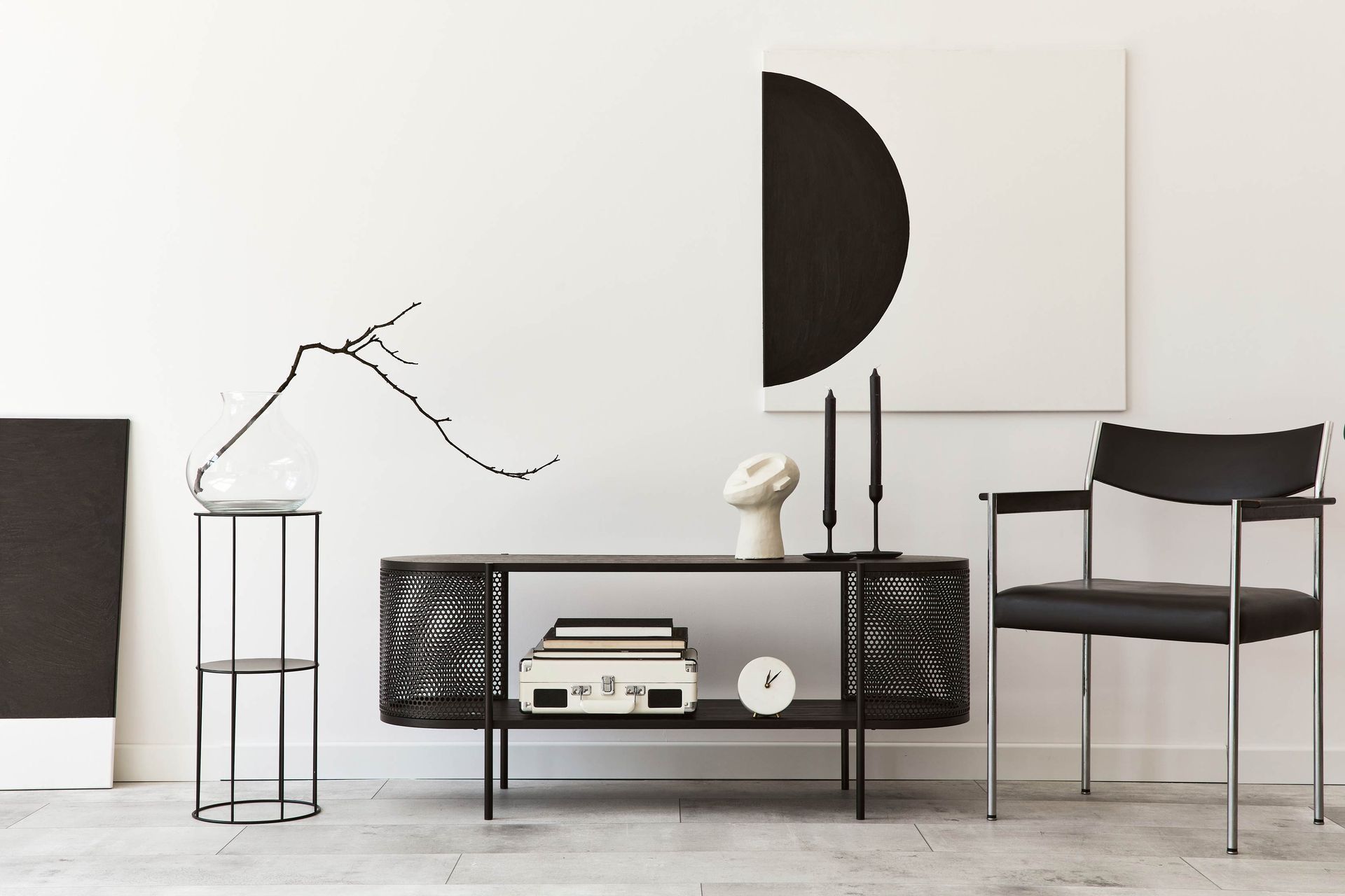 interior design of modern living room with black stylish commode chair