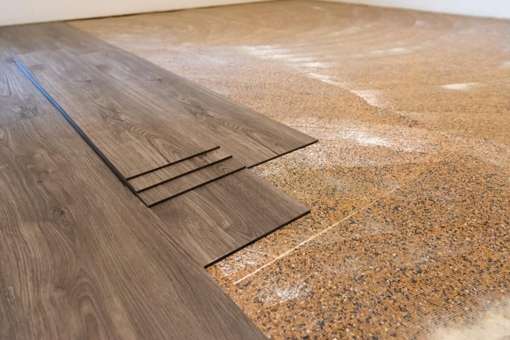 A Wooden Floor Is Being Installed In A Room — B2B Flooring Solutions In Wauchope, NSW