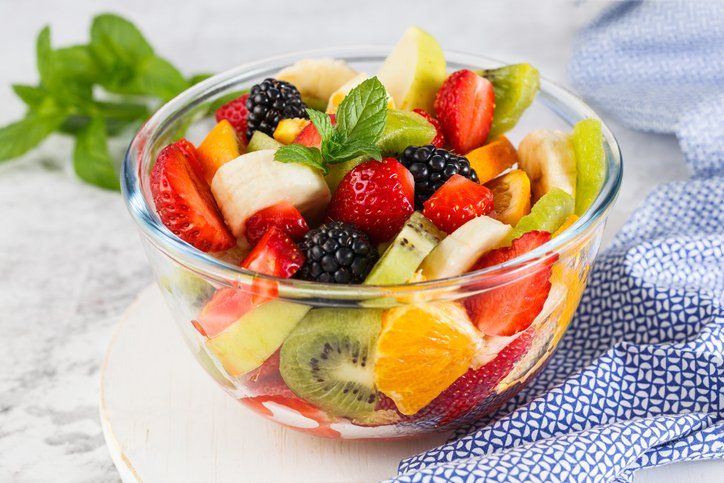 Delicious fruit salad on a plate on table