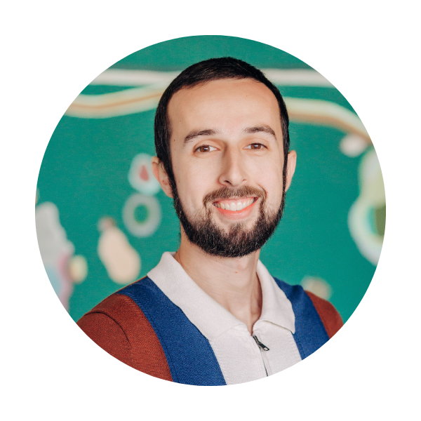 A man with a beard is smiling in a circle