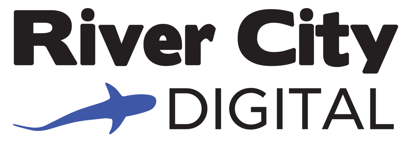 The river city digital logo has a blue shark on it.