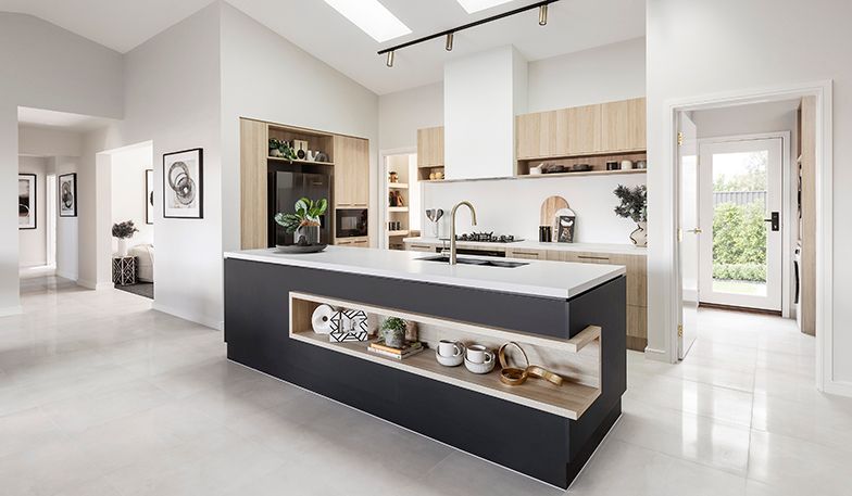 A kitchen with a large island in the middle of the room.