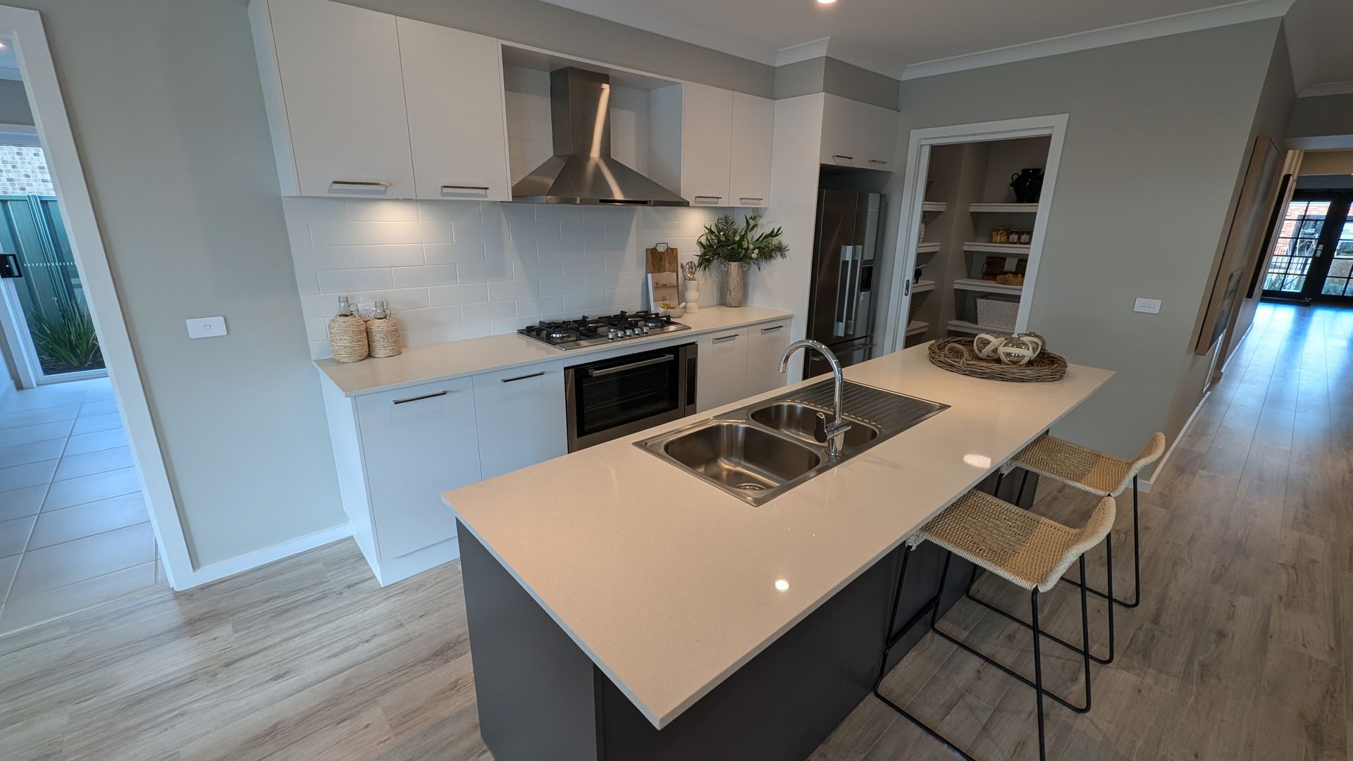 A kitchen with a large island in the middle of it.