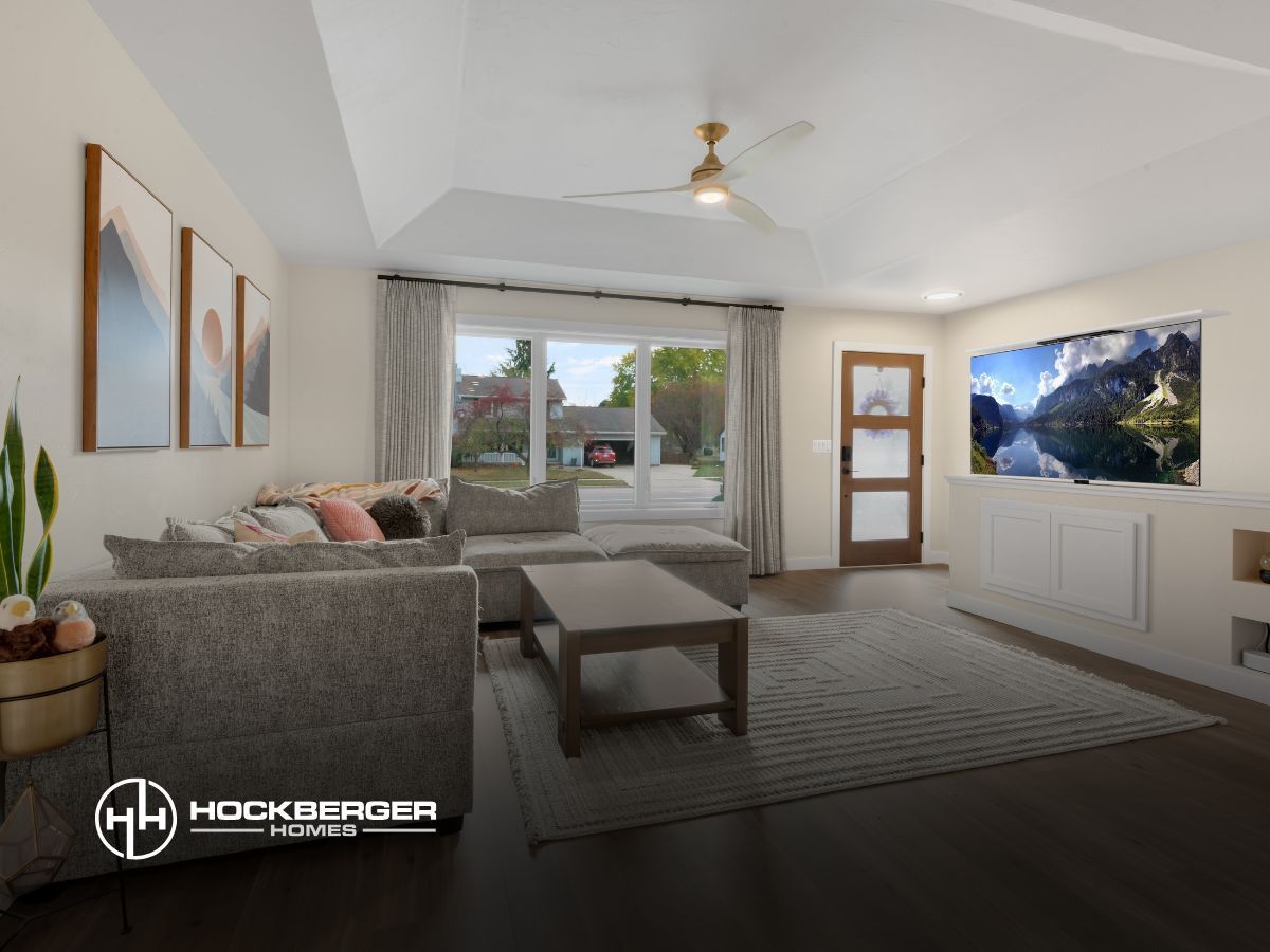 A living room with a couch , coffee table , and television.