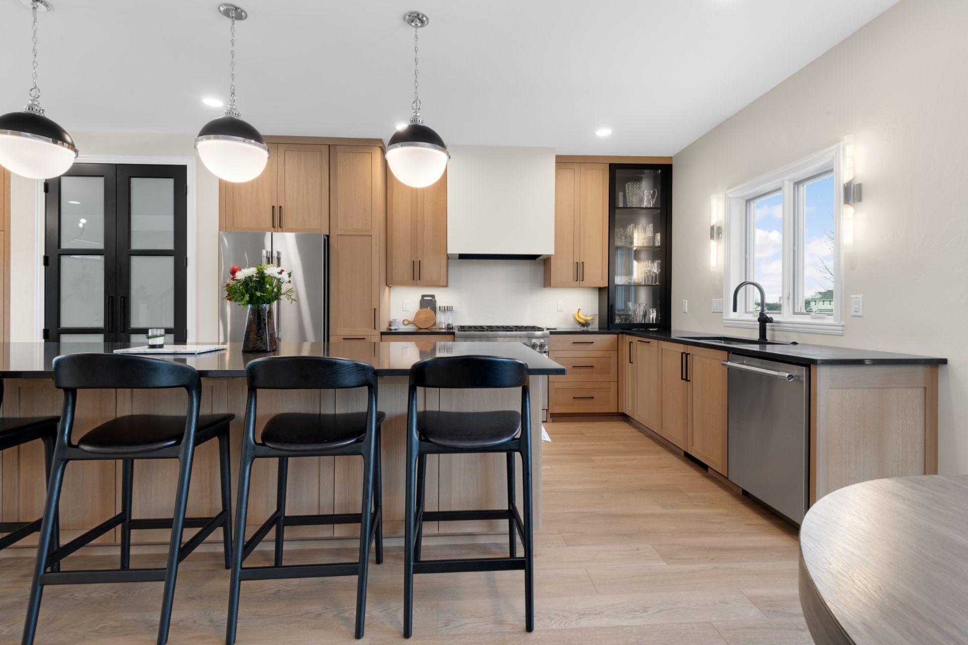 A kitchen with wooden cabinets and stainless steel appliances