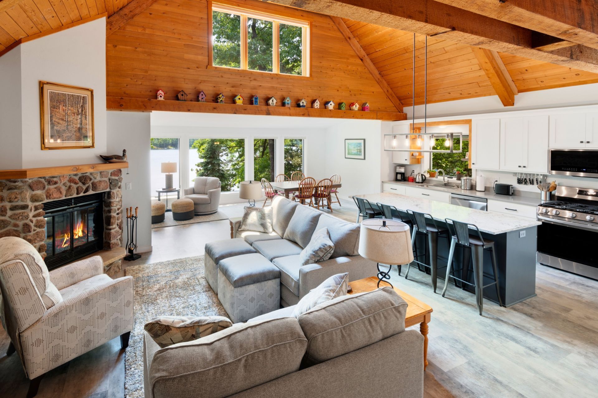 A living room with a couch and chairs and a fireplace