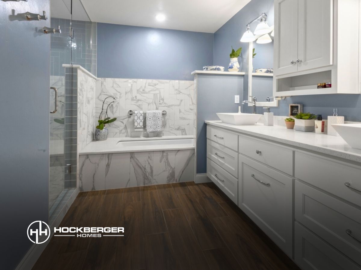 A bathroom with two sinks and a bathtub