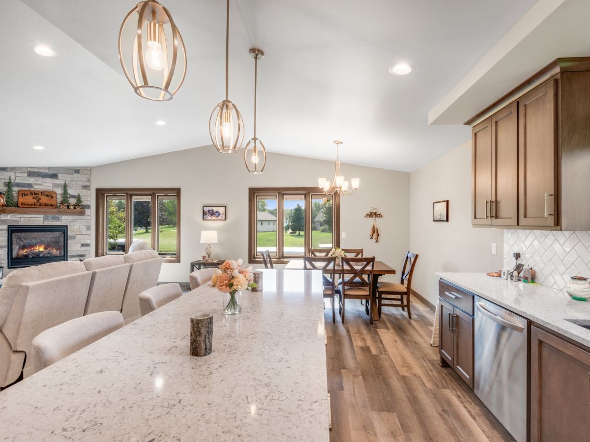A kitchen with a large island and stainless steel appliances