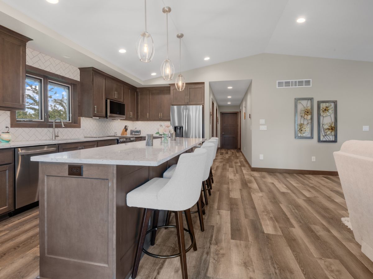 There is a large island in the middle of the kitchen.
