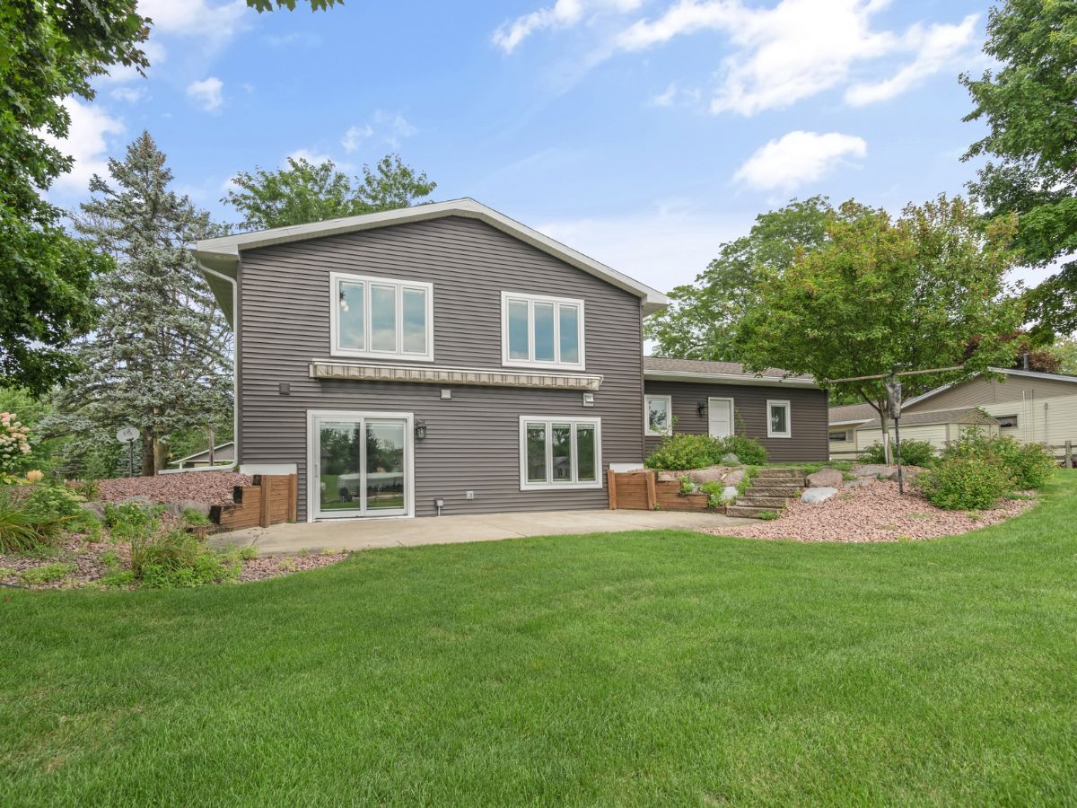 A large house with a large lawn in front of it
