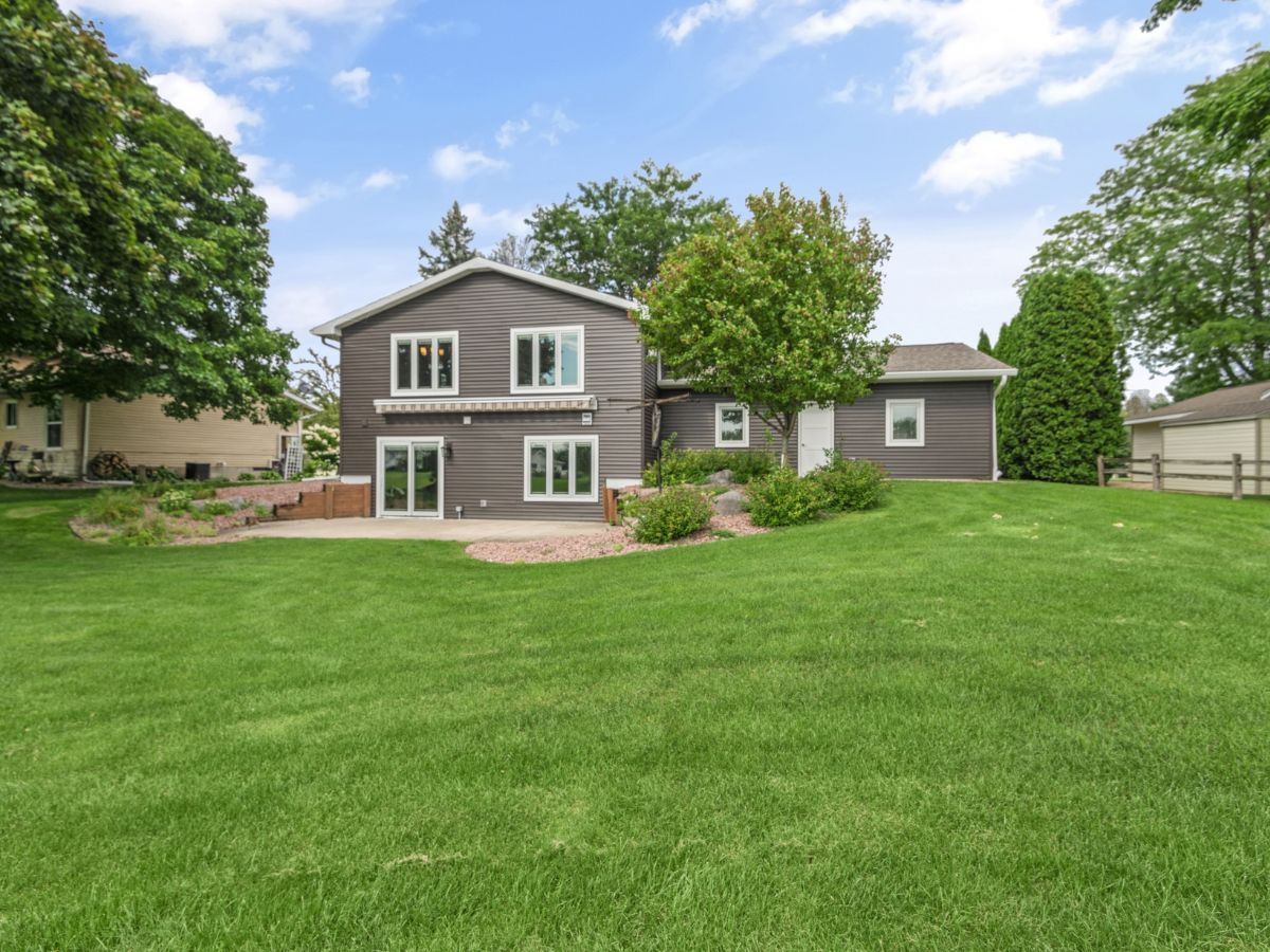 A large house with a large lawn in front of it.