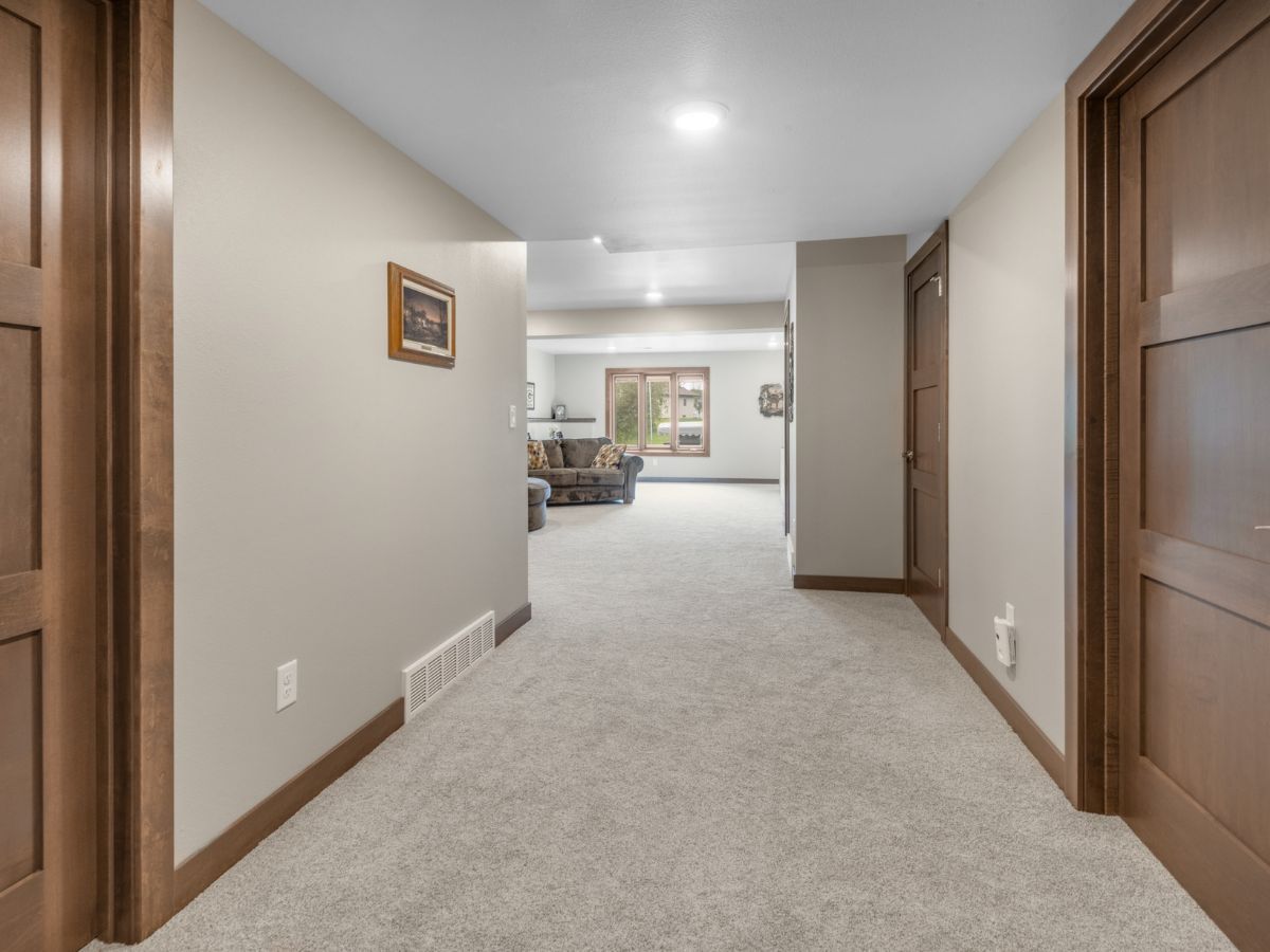 A hallway in a house leading to a living room
