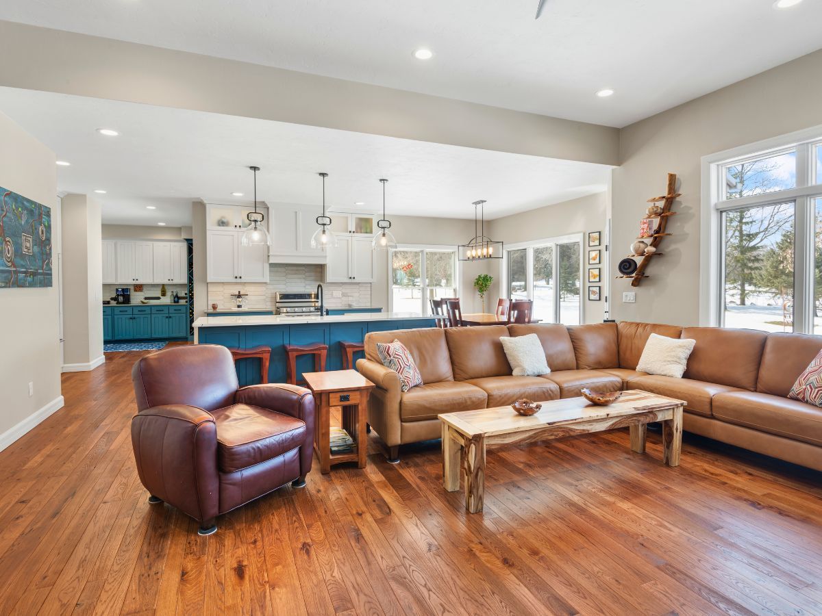 A living room with a couch , chair , and coffee table.