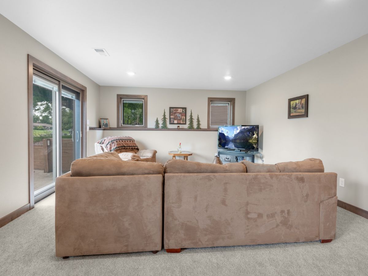 A living room with a couch and a television