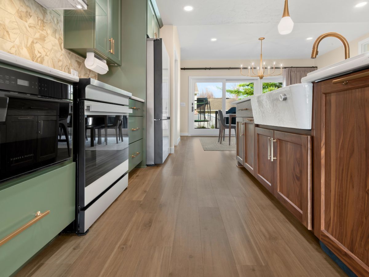 A kitchen with stainless steel appliances and wooden cabinets
