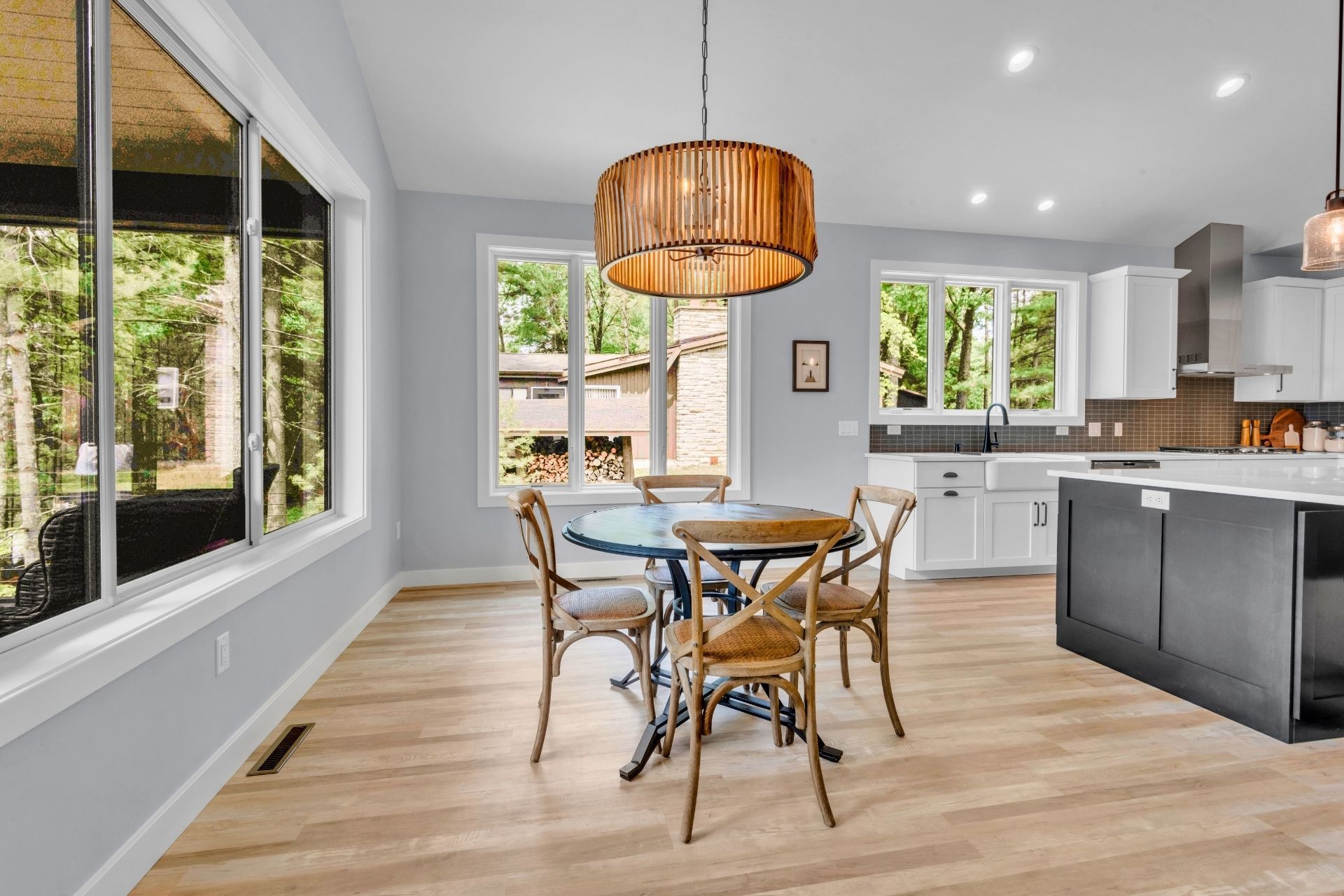 A kitchen with a table and chairs in it