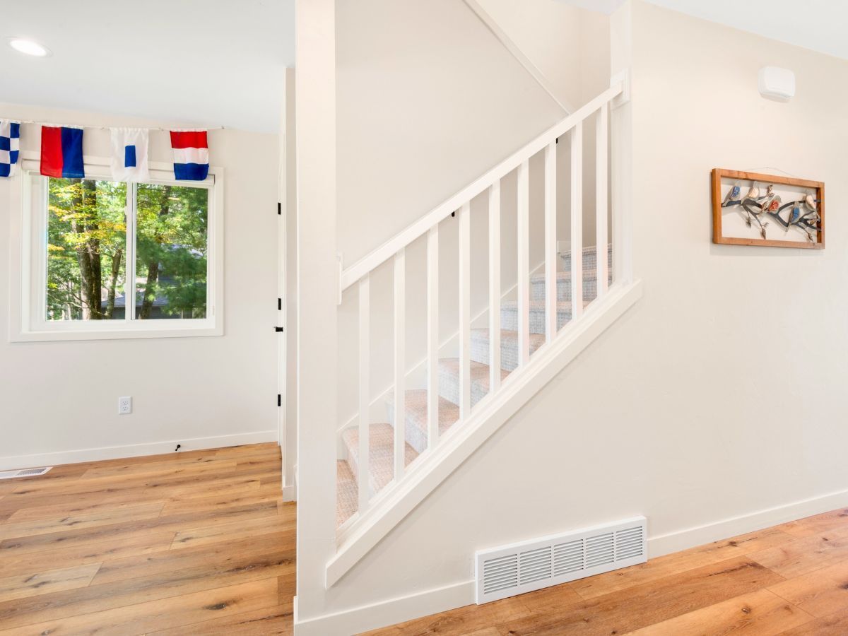 There is a staircase leading up to the second floor of a house.