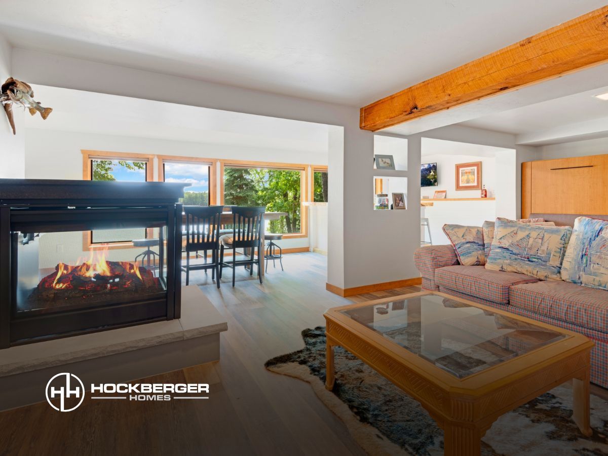 A living room with a fireplace and a couch.