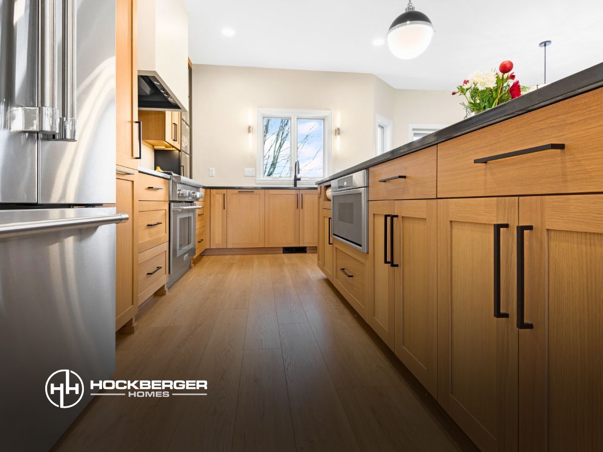 A kitchen with wooden cabinets and stainless steel appliances.
