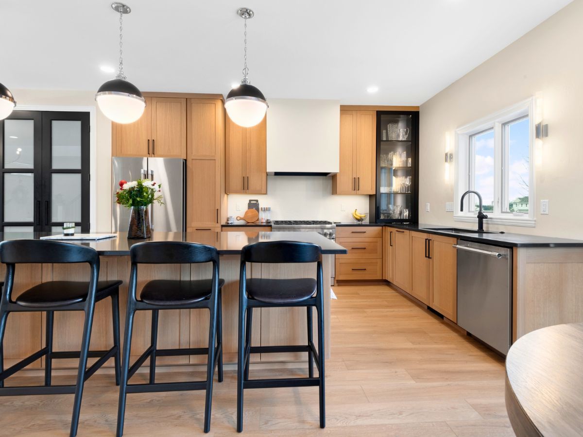 A kitchen with wooden cabinets and stainless steel appliances