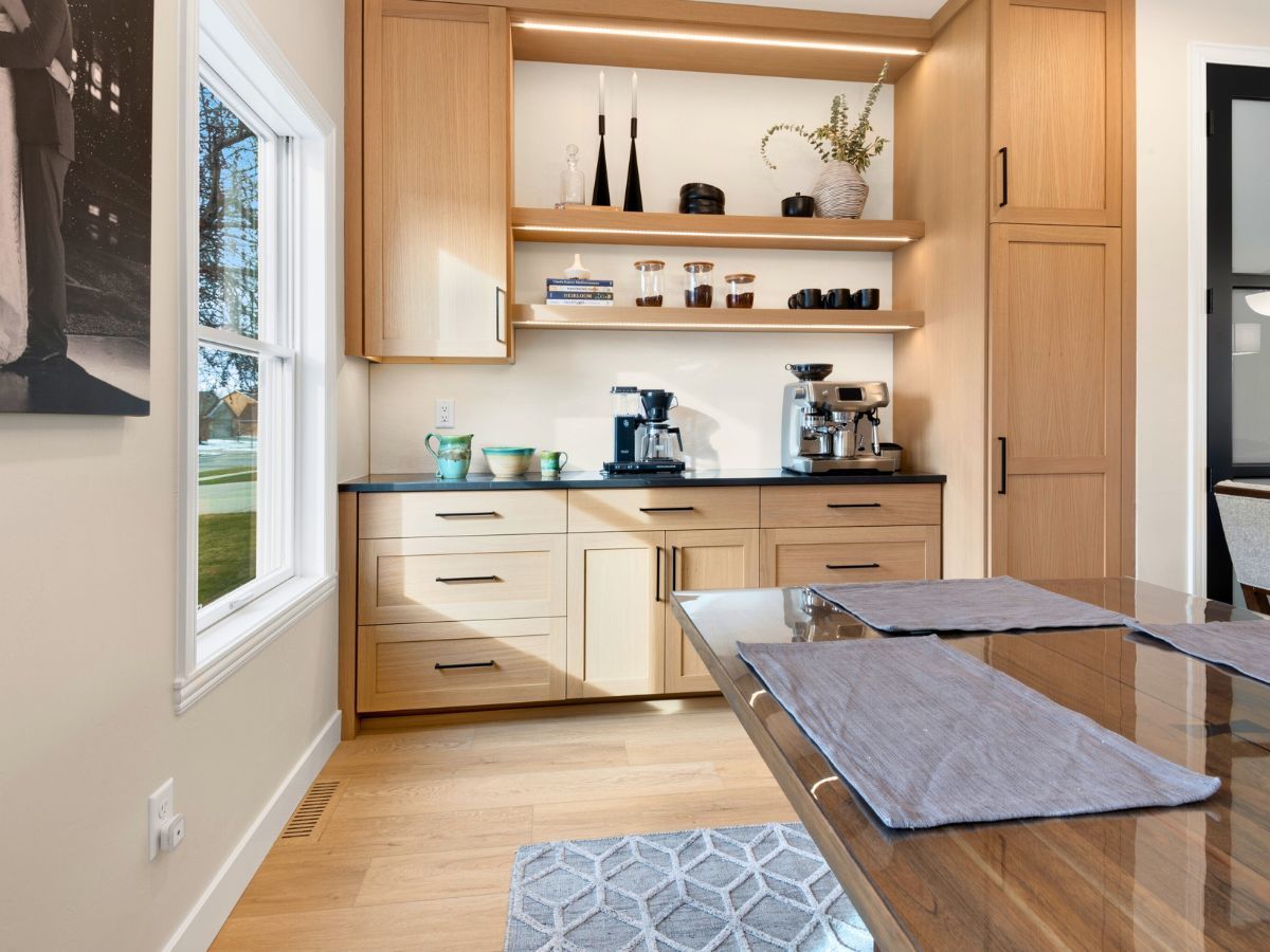 A kitchen with wooden cabinets and a coffee maker
