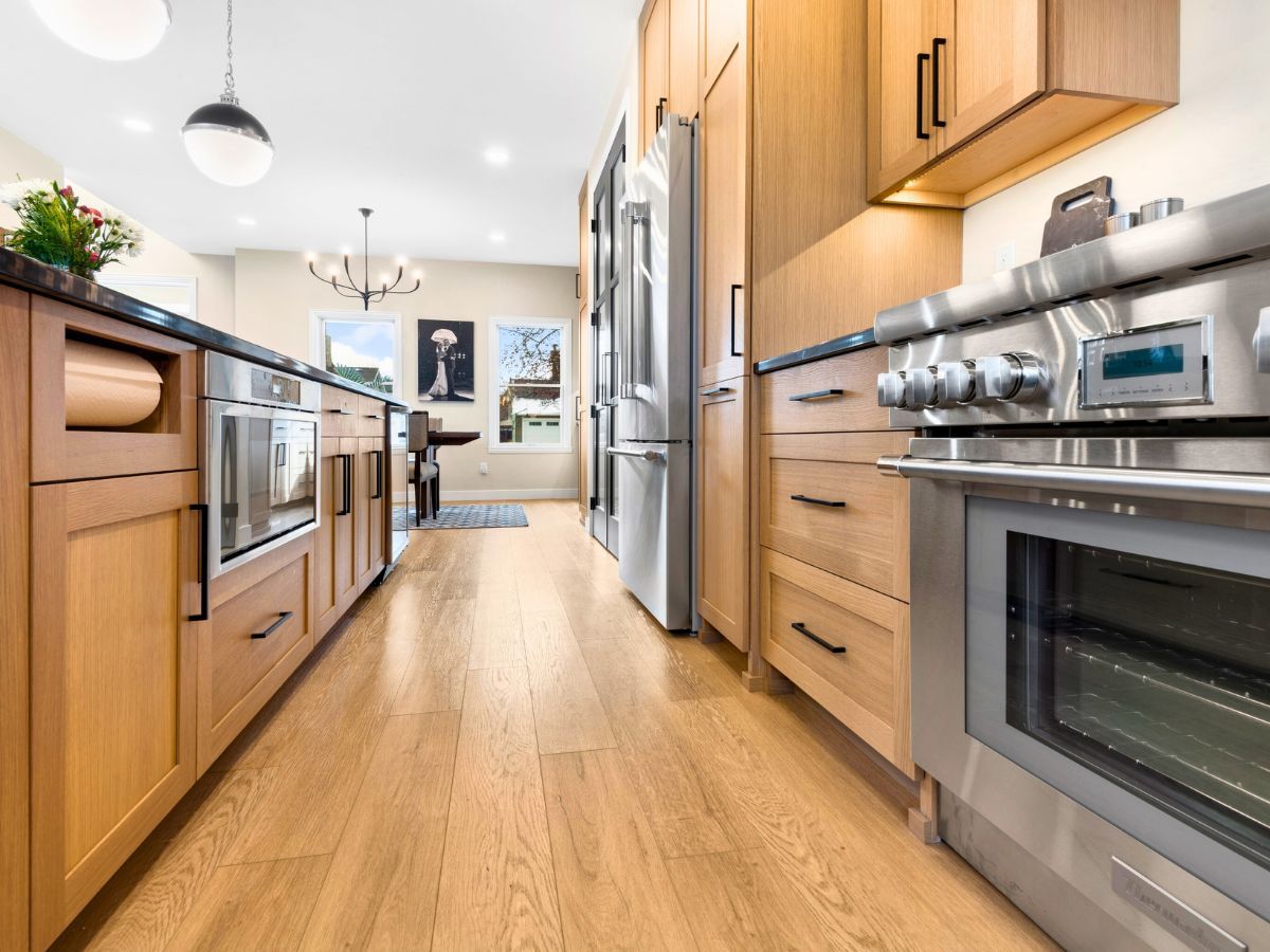 A kitchen with wooden cabinets and stainless steel appliances.