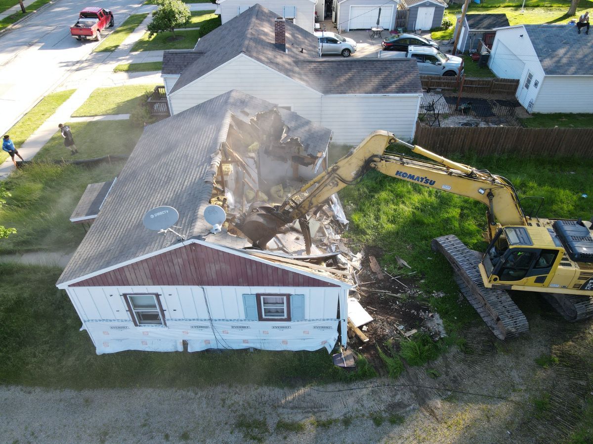 An aerial view of a house being demolished