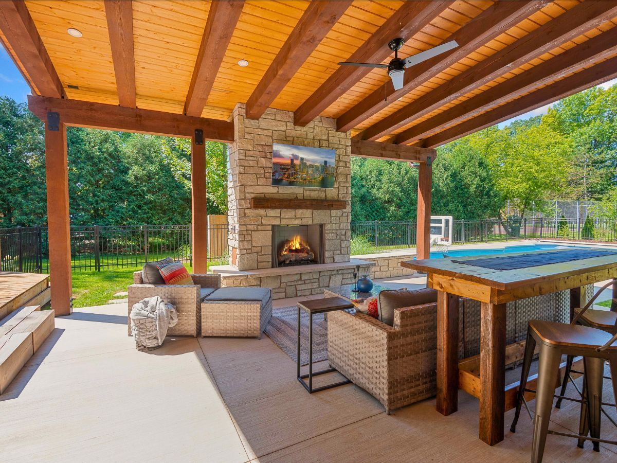 There is a fireplace in the middle of the patio.