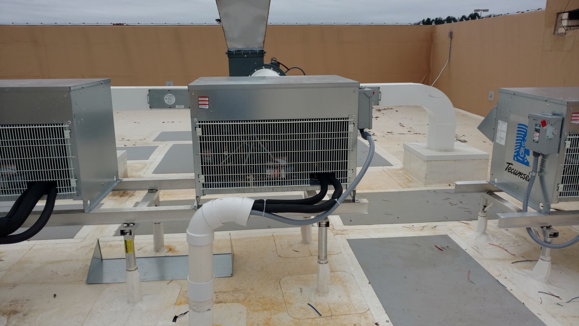 A rooftop with a lot of electrical equipment on it.