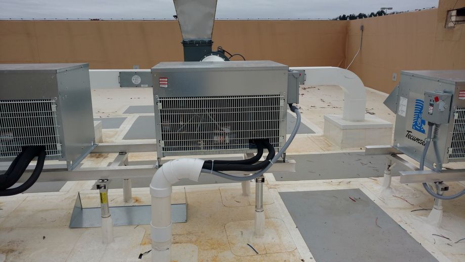 A rooftop with a lot of electrical equipment on it.